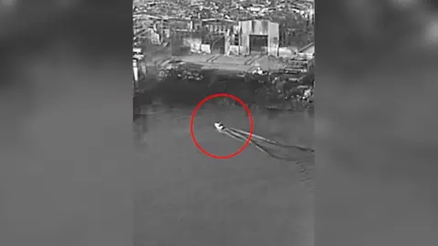 A boat is circled in red.