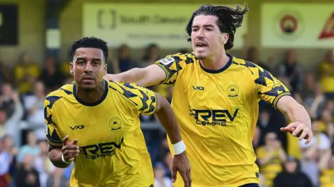 Louis Dennis celebrates scoring