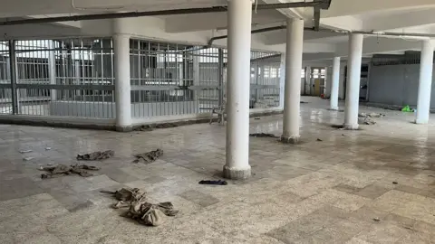 Packets of medication strewn on the floor in the prison