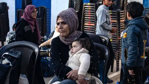 Palestinian patients wait before an evacuation organized by the World Health Organization (WHO) at the European Hospital in Khan Younis, in the southern Gaza Strip, (6 November 2024)