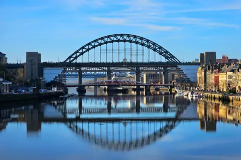 BBC Weather Watchers / Figaro Four of the bridges across the Tyne create a reflection in the water below.