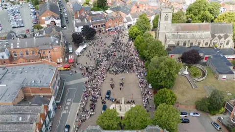 Jacob King/PA Wire An aerial view of Mr Rose's funeral cortege passing Ilkeston Cenotaph.