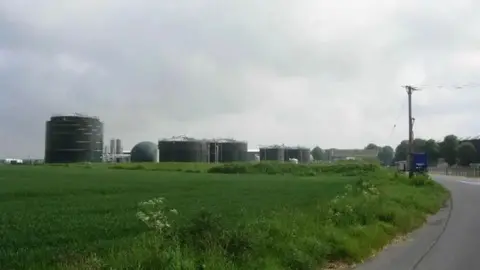 Lincolnshire County Council An anaerobic digester plant. It consists of five dark green, round buildings