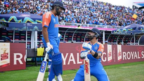 Rohit Sharma and Virat Kohli prepare to go out to bat for India