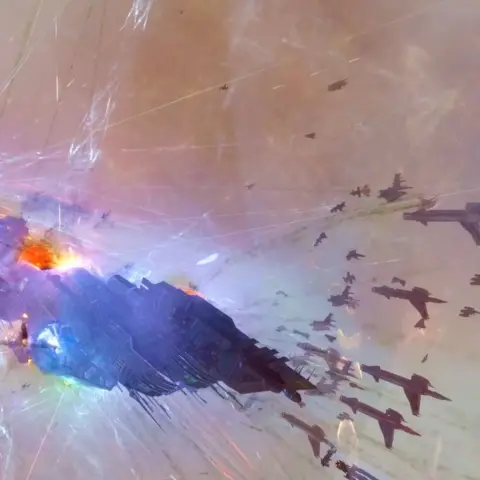 Warlock industries A large EVE Online ship drifts through space under heavy fire, its hull glowing with damage as dozens of smaller ships swarm around it, leaving trails of light amid streaking weapons fire and explosions.