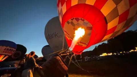 Fire in hot air balloon during night time