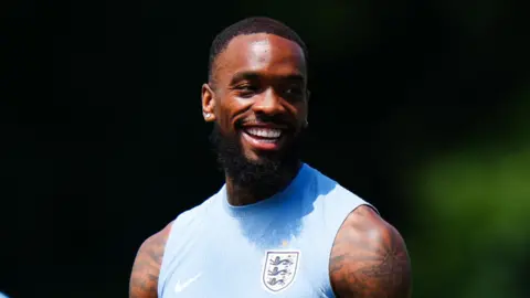 Close up of Ivan Toney in a blue training vest