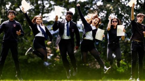Pupils from Craigmount High in Edinburgh jumping in the air after receive the results of the Scottish Qualifications Authority exam result on August 8, 2023 