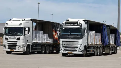 Getty Images Aid trucks near Kerem Shalom crossing.
