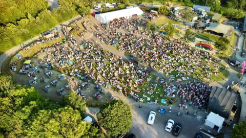 The Big Sheep A view from above a visitor attraction, which is hosting a small festival. 