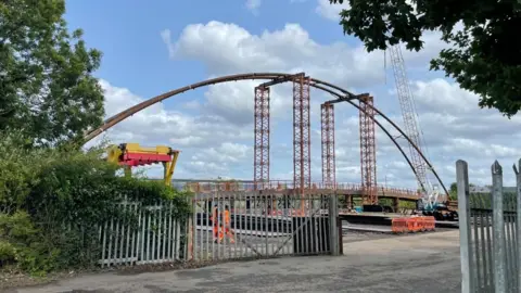 The Waterside Bridge on site at Briton Fabricators Ltd. It is a large steel arc structure