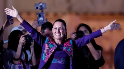 Reuters Claudia Sheinbaum gestures to supporters after being declared the winner of the presidential election according to the INE electoral institute's rapid sample count, in the Zocalo plaza in Mexico City, Mexico June 3, 2024. 