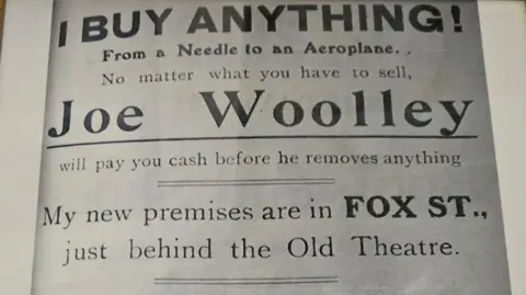 the picture shows an old leaflet handed out by ben grandfather - it reads, 'I buy anything'