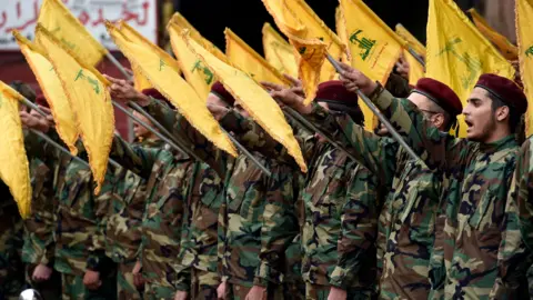 EPA Hezbollah fighters in a line