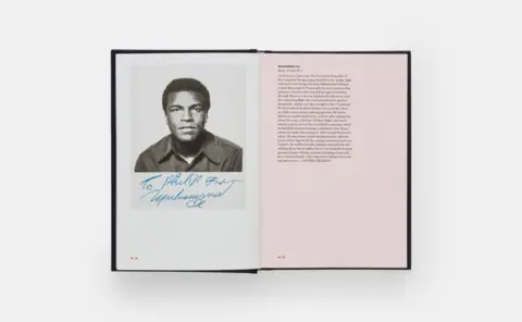 Phaidon Press Open book spread featuring a black‑and‑white studio portrait of Muhammad Ali on the left page and a full page of printed text on the right. The portrait includes a handwritten signature across the lower portion.