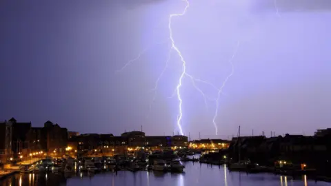 Getty Images A lighting storm over Sovereign Harbour, Eastbourne (file photo)