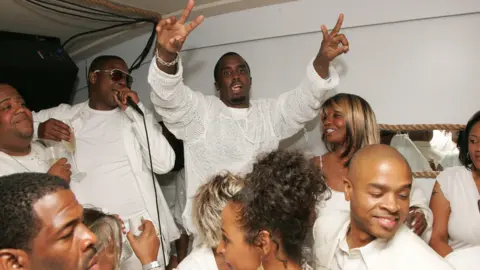 Getty Images Sean "Diddy" Combs photographed throwing up   bid    signs astatine  his aft  enactment      for "The Real White Party" connected  September 2, 2007 successful  East Hampton, New York.