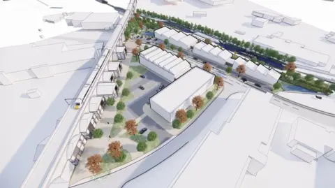 City of Wolverhampton Council An artist's impression shows units in white in the middle, along with some trees and bushes nearby. A train is on the left of this aerial image.