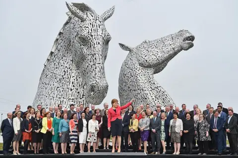 Getty Images Nicola Sturgeon hosts a photocall at the Kelpies sculpture with many of the SNP MSPs who were elected in the 2016 election