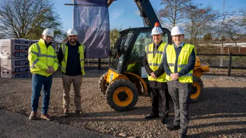 L-R): Harvey Brand, Keon Homes Site Manager, Matt Wilkes, Keon Homes Project Manager, Cllr Steve Evans, City of Wolverhampton Council Deputy Leader and Cabinet Member for City Housing, George Williams, City of Wolverhampton Council Service Manager Housing Assets