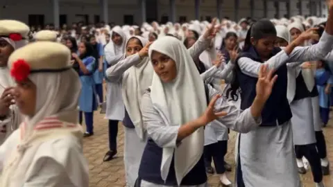 Sasi Kayyoor The photo shows Muslim girls at Thanbihul Islam Higher Secondary School in Kerala's Kasaragod district participating in a Zumba session
