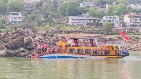 Rescue authorities at the scene in Qianxi city