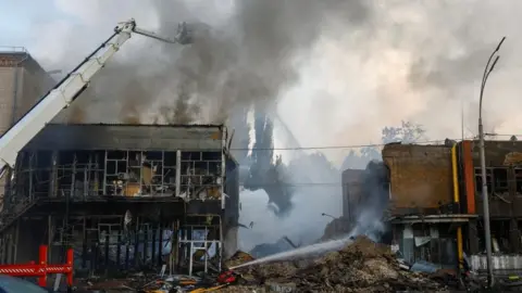 Firefighters work at the site of a Russian drone and missile strike, amid Russia's attack on Ukraine, in Kyiv, Ukraine on June 6