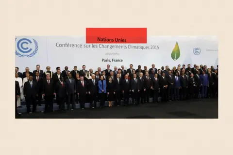 AFP via Getty Images World leaders pose for a family picture during the COP21, United Nations Climate Change Conference

