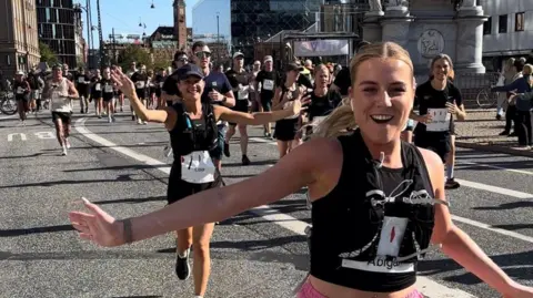 Lois Vidamour Lois Vidamour and Abi Tardival cheering running the marathon. 