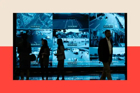 AFP via Getty Images A bank of CCTV cameras