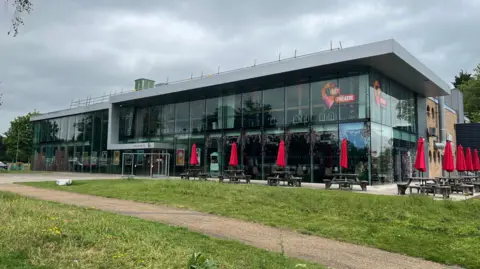 A general view of the Key Theatre from the outside. It is a large, predominantly glass building. 