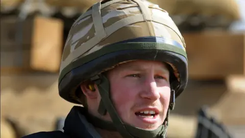 Prince Harry sits in an area of the observation post on JTAC Hill, close to FOB (forward operating base) Delhi, on January 2, 2008 in Helmand province