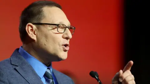 Reuters close-up of Avi Lewis speaking into a microphone