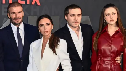 David and Victoria Beckham pose with Brooklyn Beckham and Nicola Peltz at the premiere of David’s self-titled 2023 Netflix documentary