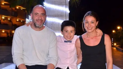 John Nithavrianakis, his wife Amanda and their son Nico