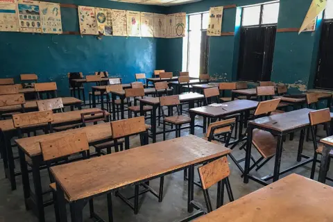 AFP via Getty Images An empty classroom at St Mary's Catholic School two days after the abduction of 303 pupils on 21 November 2025.