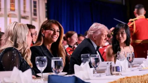 U.S. President Donald Trump and first lady Melania Trump attend the annual White House Correspondents' Association dinner at a hotel in Washington, D.C., U.S., on 25 April 2026