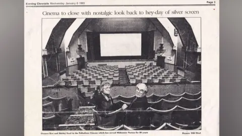 Duncan Steel A black and white newspaper cutting from 1993 with a photo of Ken and Shirley sitting in the auditorium of the cinema