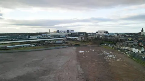 Westmorland and Furness Council The section of land that has been cleared ahead of development of the Marina Village in Barrow.