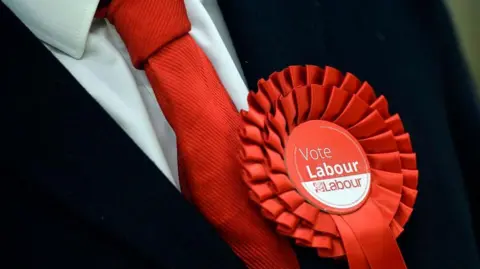 PA media Labour Party rosette