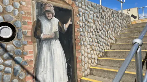 Shaun Whitmore/BBC A Colin Seal mural in Sheringham