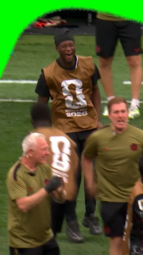 Ismaël Koné hops on to the pitch to celebrate with his Canada team mates at the 2026 World Cup