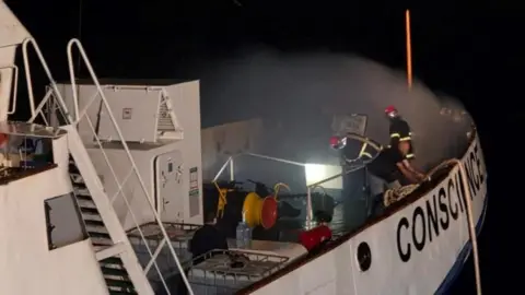 Reuters irefighters try to extinguish a fire onboard the Gaza Freedom Flotilla vessel Conscience