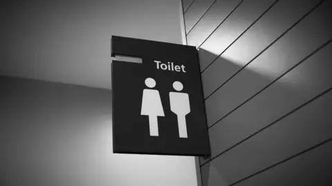 Getty Images Sign for toilets