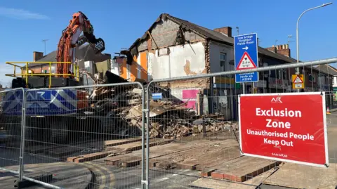 Demolition crews started ripping down buildings on Wednesday