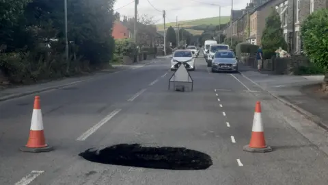 John Ireland Sinkhole in Hayfield Road, New Mills, Derbyshire