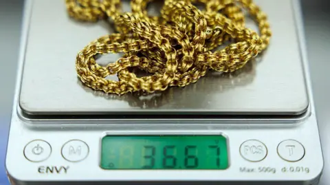 Getty A close up of a gold chain on a set of scales in a jeweller in Hatton Gardens