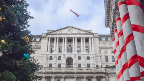 Getty Images General view of the Bank of England, the Royal Exchange and a Christmas tree decorated with blue and gold baubles.