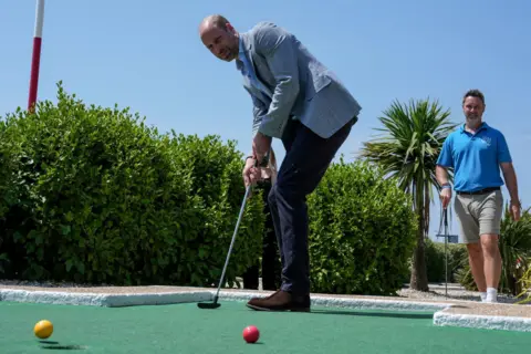 Prince William playing crazy golf