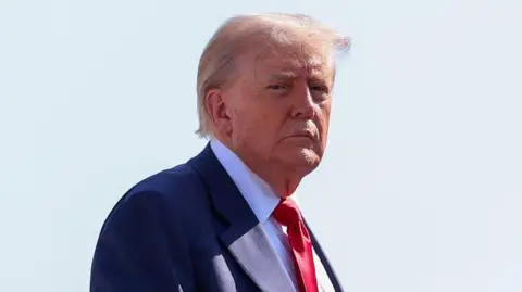 Reuters U.S. President Donald Trump boards Air Force One, as he departs for Scotland, at Joint Base Andrews, Maryland, U.S., July 25, 2025.